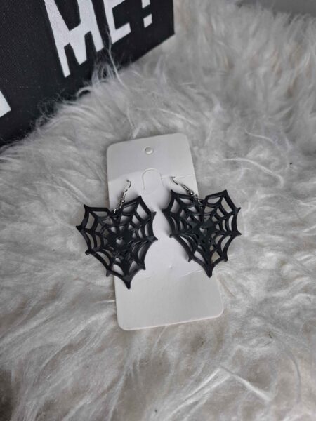 brinco draculaura teia